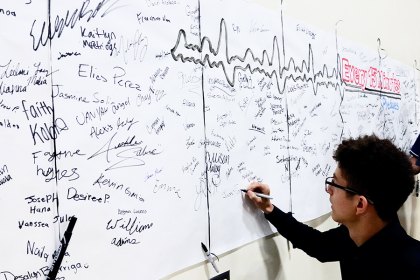 A Lemoore High School student signs a pledge not to drink.